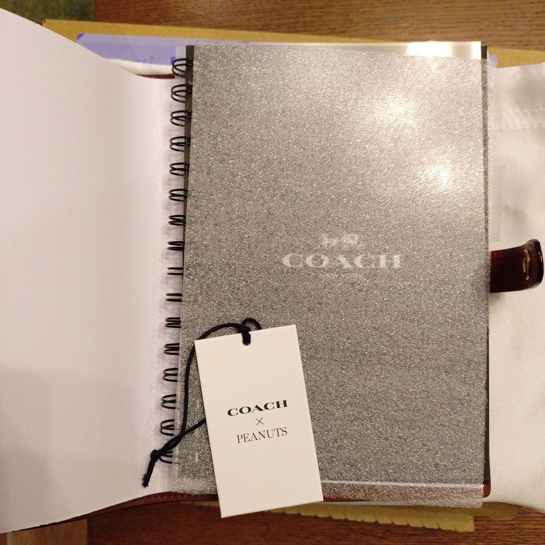 コーチ　スヌーピーコラボ　ノートブックシグネチャーキャンバス
