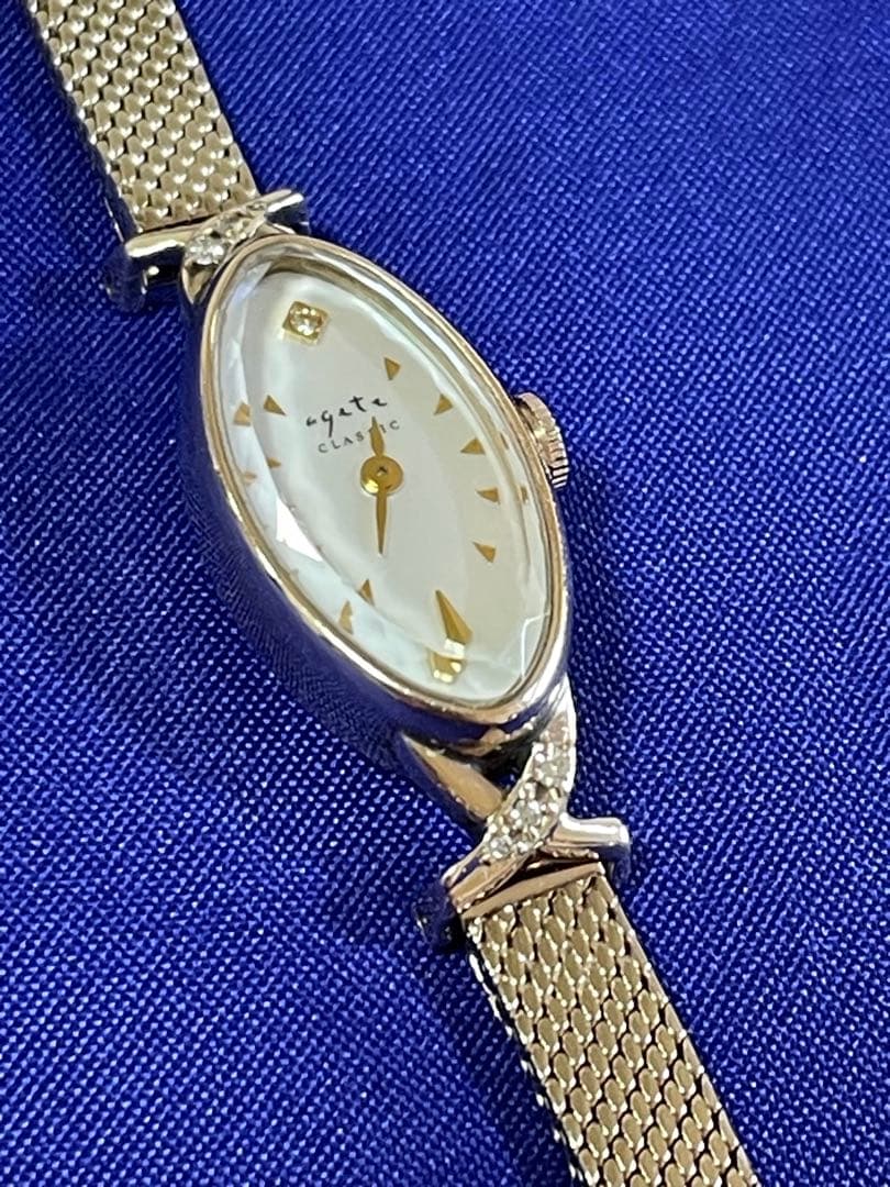 agete アガット　オーバルフェイス　ジュエリーウォッチ　ダイヤ　シェル
