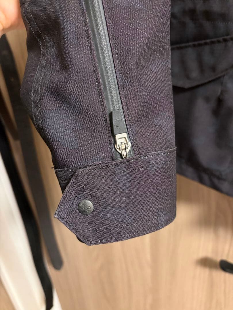 クシタニ フィンジャケット ブラックカモフラ/L